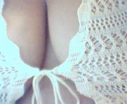 Volumptuous green eyed triple D latina masseuse