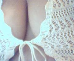 Volumptuous green eyed triple D latina masseuse